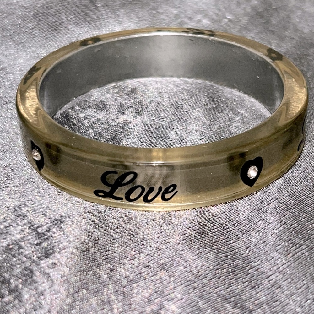 Love bangle with rhinestone in heart design.